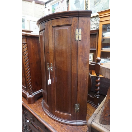 1158 - An 18th century mahogany hanging bowfront corner cupboard, 82 x 57cm.