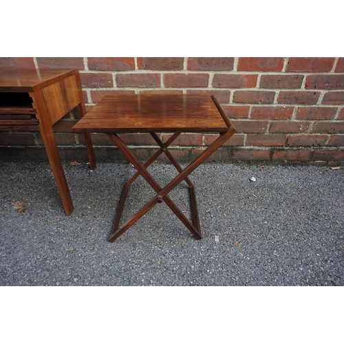 1163 - A vintage Danish rosewood metamorphic nest of three folding occasional tables, labelled 'Silkeborg',... 