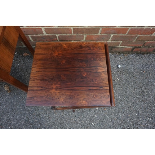 1163 - A vintage Danish rosewood metamorphic nest of three folding occasional tables, labelled 'Silkeborg',... 