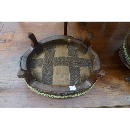 1167 - A pair of Victorian carved walnut and upholstered oval footstools, 38cm wide. ... 