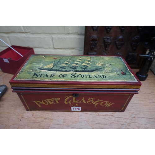 1176 - A painted metal casket, 35cm wide; together with a brass beetle doorstop, 26cm long.... 