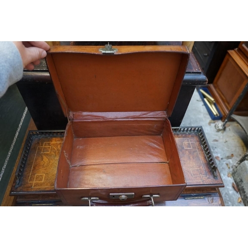 1198 - Four vintage leather suitcases, the smallest inscribed 'James Ramsay, Goldsmith, Dundee', largest 45... 