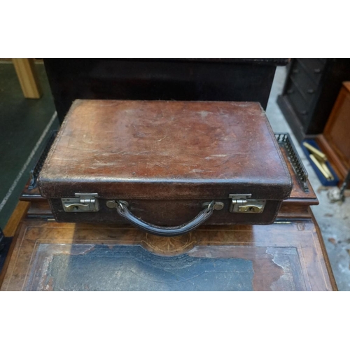 1198 - Four vintage leather suitcases, the smallest inscribed 'James Ramsay, Goldsmith, Dundee', largest 45... 