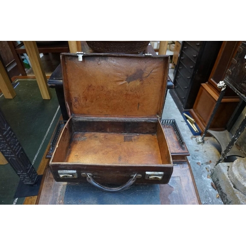 1198 - Four vintage leather suitcases, the smallest inscribed 'James Ramsay, Goldsmith, Dundee', largest 45... 