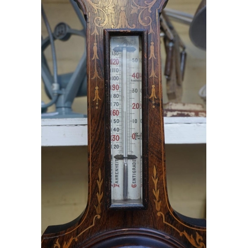 1218 - A late 19th century rosewood and inlaid aneroid banjo barometer, 69cm high, (s.d).