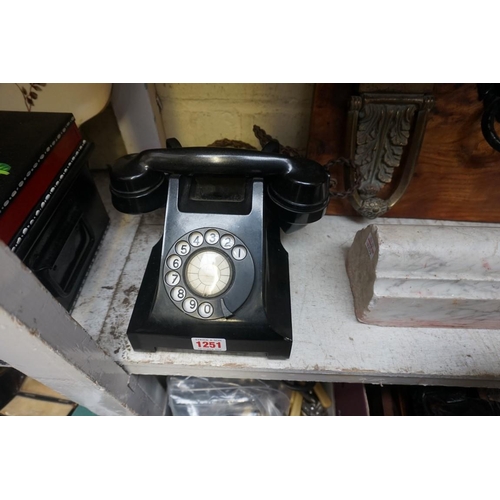 1251 - A vintage ATM black Bakelite telephone. 