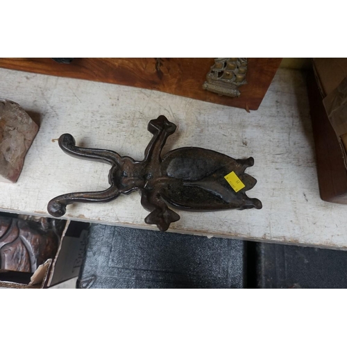 1253 - A cast iron beetle doorstop; together with another marble doorstop, each 26cm long. ... 