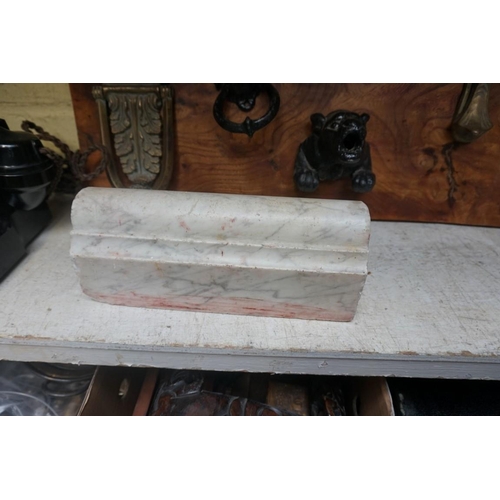 1253 - A cast iron beetle doorstop; together with another marble doorstop, each 26cm long. ... 