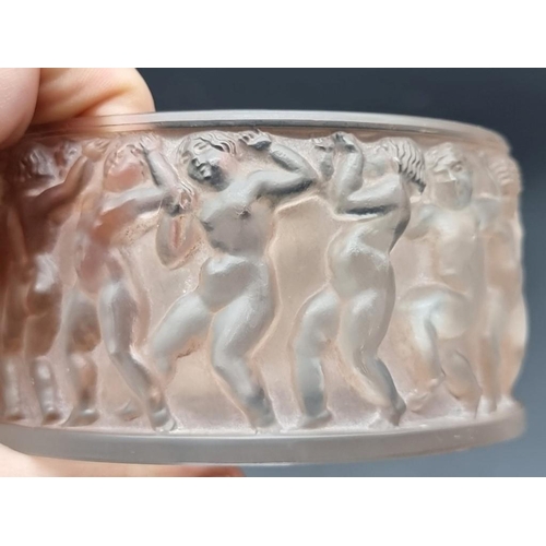 1286 - A Lalique 'Enfants' pattern frosted glass circular box and cover, 11cm diameter.