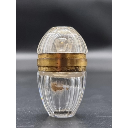 1297 - A good antique French cut glass and gilt metal mounted ovoid scent bottle, 5.5cm high, in conforming... 