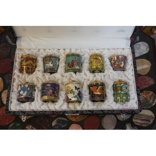 1339 - A cased set of ten Chinese cloisonne enamel boxes and covers, largest 5.5cm high. ... 