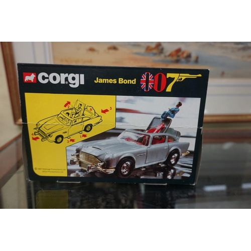 1342 - Corgi: a boxed James Bond Aston Martin No.271, with red interior and three figures (two on plastic s... 