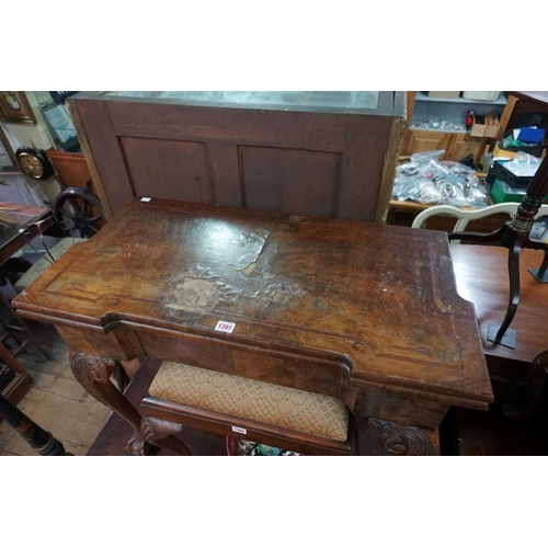 1391 - A 18th century figured walnut card table, with outset corners, on cabriole legs with ball and claw f... 