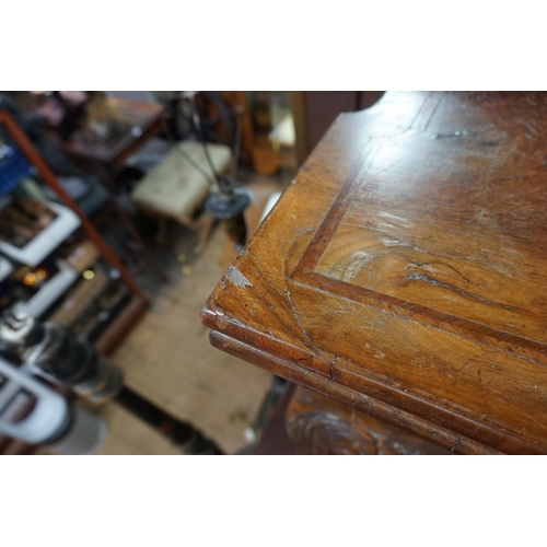 1391 - A 18th century figured walnut card table, with outset corners, on cabriole legs with ball and claw f... 