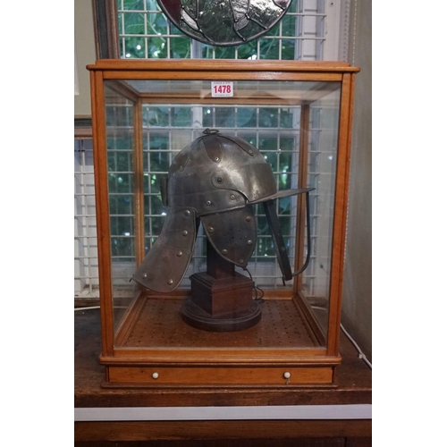 1478 - A reproduction Cromwellian 'lobster tail' helmet, in glazed display case, 51cm high x 39cm wide.... 