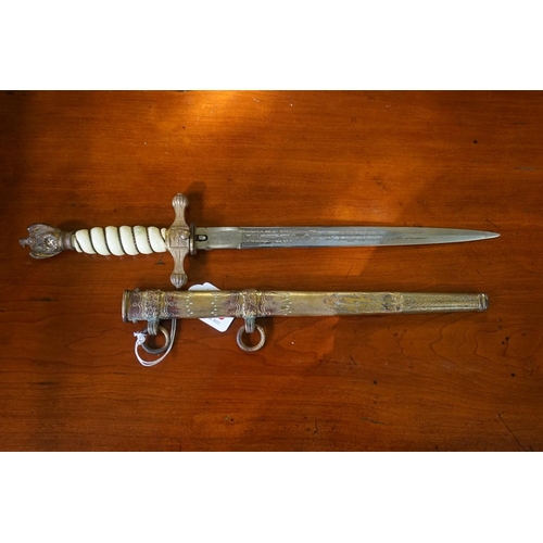 1793 - A German Third Reich Kriegsmarine Naval Officer's dagger and gilt sheath, having 24.5cm etched blade... 