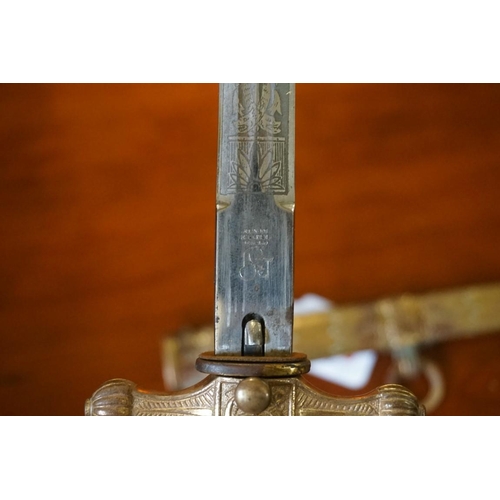 1793 - A German Third Reich Kriegsmarine Naval Officer's dagger and gilt sheath, having 24.5cm etched blade... 