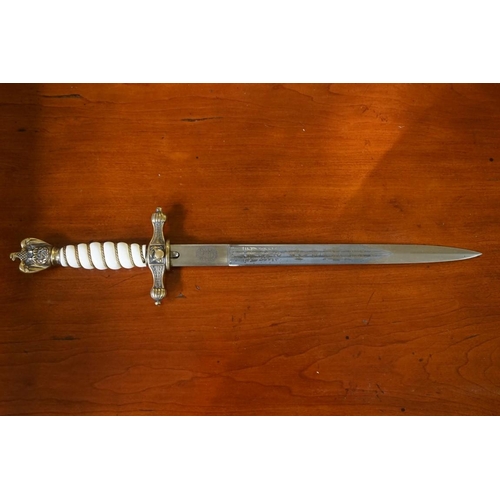 1797 - * WITHDRAWN * A German Third Reich Kriegsmarine Officer's dagger and sheath, having 24.5cm etched bl... 