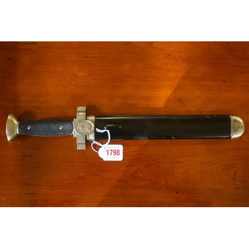 1798 -  A German Third Reich Red Cross 'Hewer' dagger and sheath, the 26.5cm saw back blade inscribed 'Ges.... 