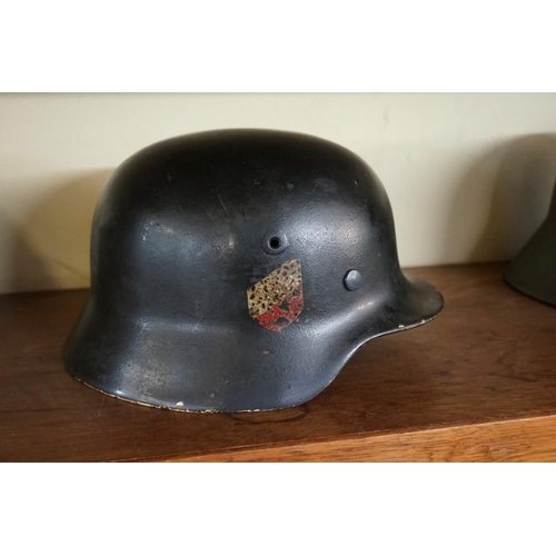 1806 - A German Third Reich M35 pattern steel helmet, bearing two decals, with liner.