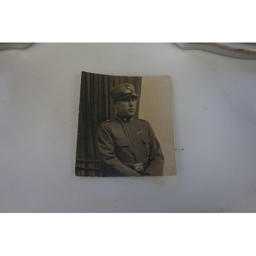 1808 - An interesting Italian World War I Adrian steel helmet, with liner and strap, combat bullet entry an... 