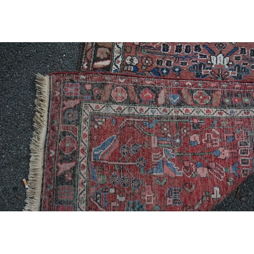 1064a - A village Hamadan rug, 202 x 107cm.