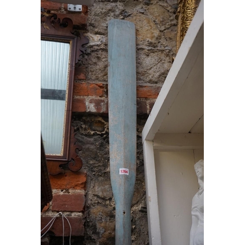 1264 - A large blue painted oar, 294.5cm long. 