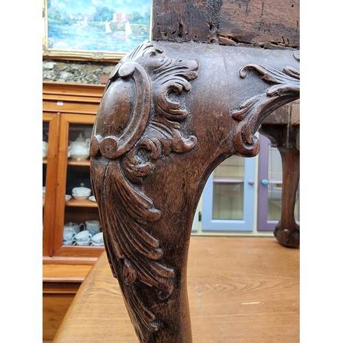 1161 - A 1930s, 18th century style, carved walnut cabriole leg stool, on ball and claw feet, 61cm wide, (la... 