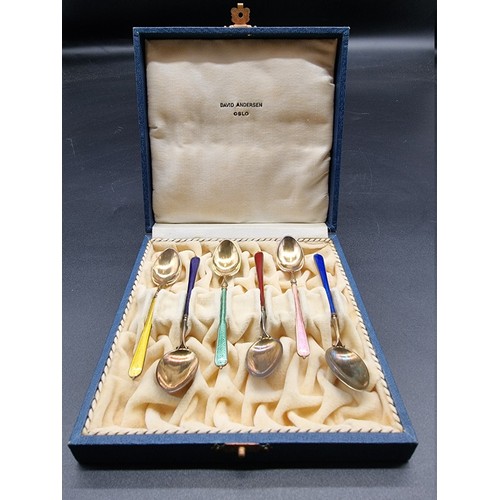 554 - A cased set of six Norwegian silver gilt and coloured enamel coffee spoons, stamped '925', in David ... 