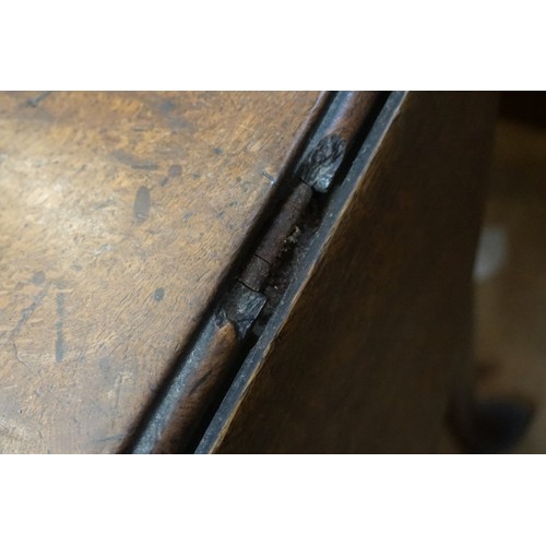 1398 - An 18th century oak gateleg table, on turned legs with pad feet, 154cm long.