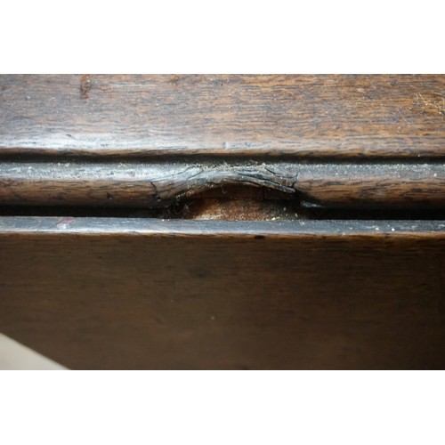 1398 - An 18th century oak gateleg table, on turned legs with pad feet, 154cm long.