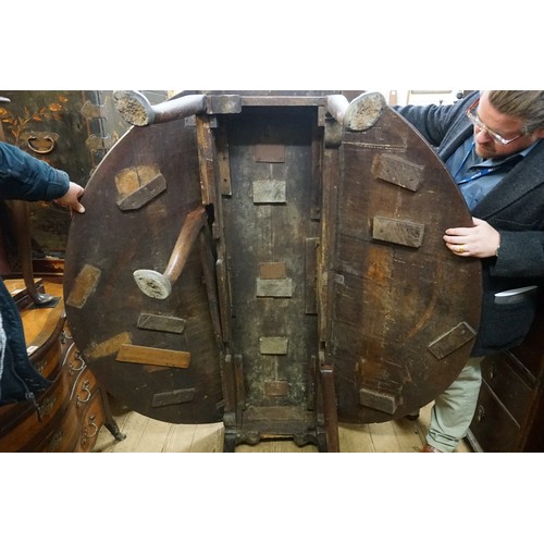 1398 - An 18th century oak gateleg table, on turned legs with pad feet, 154cm long.