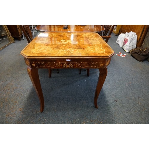 1275 - An Italian walnut and marquetry games table, incorporating backgammon and chequerboards and further ... 