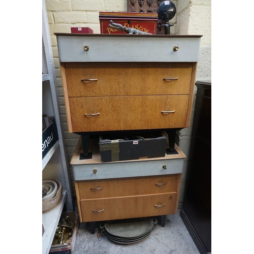 1027 - A pair of mid century oak three drawer chests, by Avalon, 73.5cm high x 78cm wide.