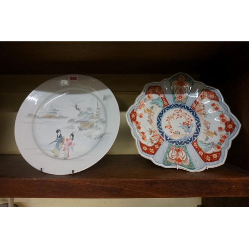 1161 - Two Japanese porcelain chargers, to include an Imari example, of shaped outline, 32.5cm diameter. (2... 