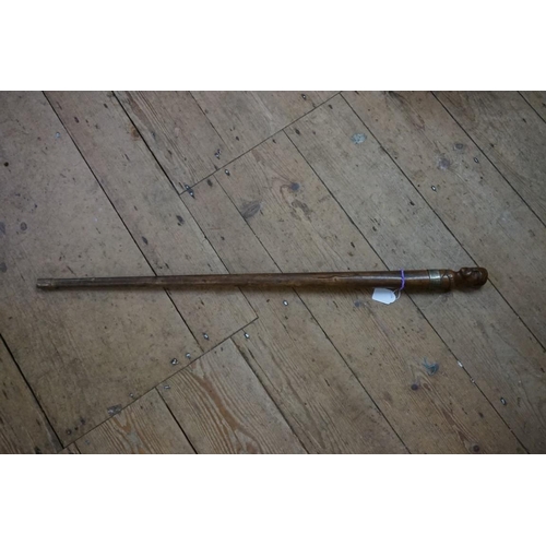 1807 - An interesting 19th century carved wood cane, with novelty portrait terminal and brass plaque i... 