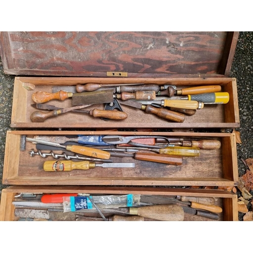 1007 - A wood box containing a quantity of old tools.