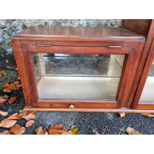 1010 - An Edwardian inlaid display cabinet, 157cm wide x 29cm deep x 49cm high.