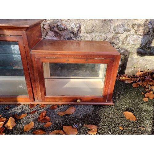 1010 - An Edwardian inlaid display cabinet, 157cm wide x 29cm deep x 49cm high.