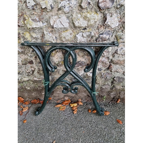 1011 - A pair of cast iron table supports, 66cm wide x 62cm high.