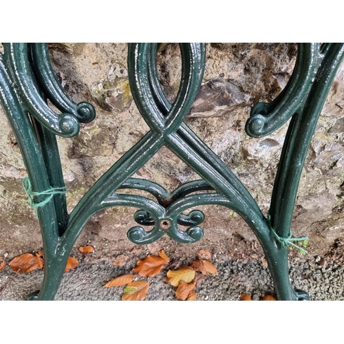 1011 - A pair of cast iron table supports, 66cm wide x 62cm high.