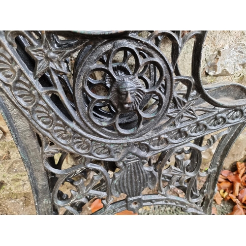 1012 - A pair of cast iron bench ends.