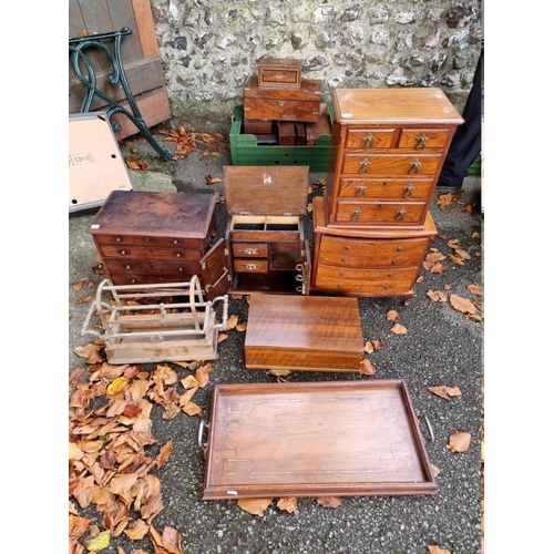 1013 - Three miniature chests of drawers; together with a small smokers chest and trays.