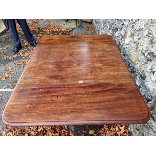 1023 - A William IV mahogany pedestal Pembroke table, 118cm wide when open.