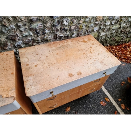 1027 - A pair of mid century oak three drawer chests, by Avalon, 73.5cm high x 78cm wide.