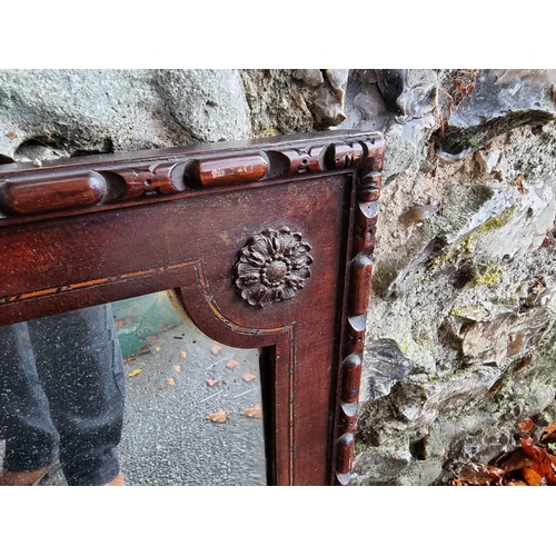 1031 - A carved mahogany and inlaid bevelled overmantel mirror, 100cm wide x 65cm high. ... 