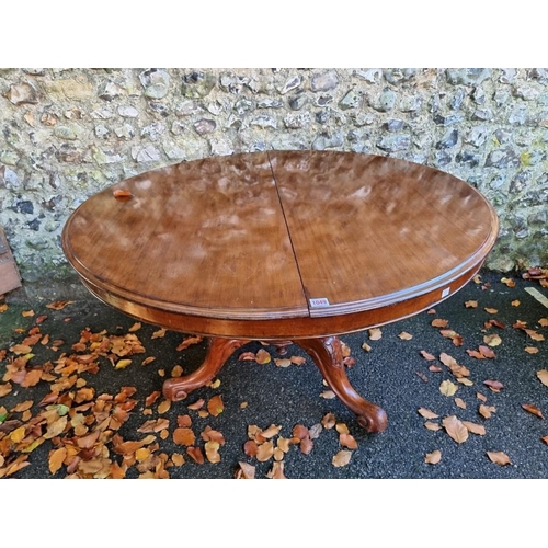 1049 - A large mahogany circular top tripod table, 117cm wide. 