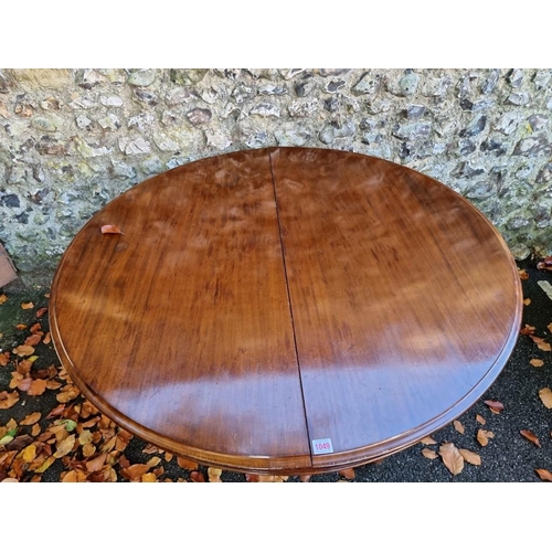 1049 - A large mahogany circular top tripod table, 117cm wide. 