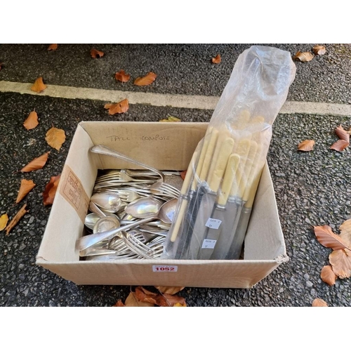 1052 - A box of silver plated items. 