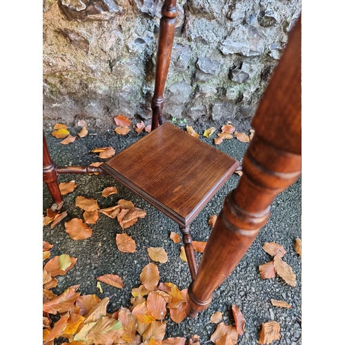 1053 - A mahogany hexagonal table, 74cm wide x 76cm high. 